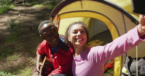 Happy Couple Taking Selfie While Camping