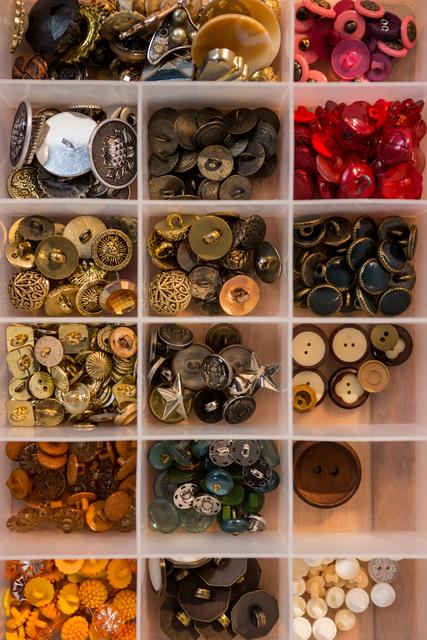 Close-up of various types of buttons in a box