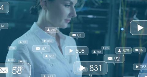 Mid-adult woman monitoring network analytics overlays in data center with ui graphics