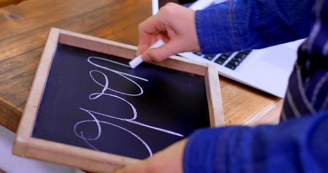 Person Writing on Small Chalkboard with Chalk - Download Free Stock Images Pikwizard.com