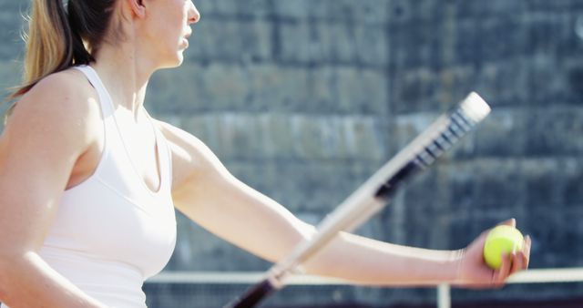 Female Tennis Player Preparing to Serve on Outdoor Court - Download Free Stock Images Pikwizard.com