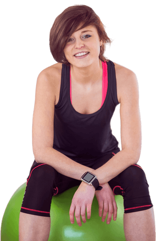 Smiling Woman in Sportswear Sitting on Transparent Exercise Ball
