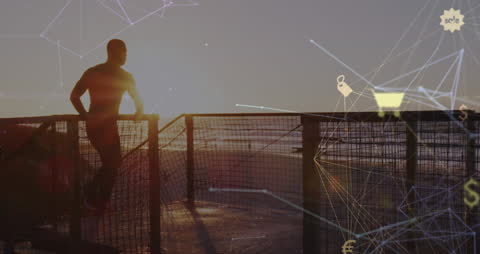 Silhouette of Man Jogging on Beach at Sunset with Connected Icons