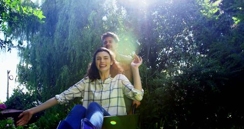 Joyful Couple Enjoying Outdoor Fun on a Sunny Day