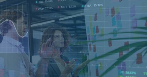 Diverse Team Discussing Stock Market Strategies with Graph Overlay - Download Free Stock Images Pikwizard.com