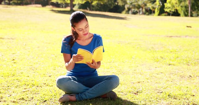 Young Woman Reading Book Outdoors in Sunny Park - Download Free Stock Images Pikwizard.com