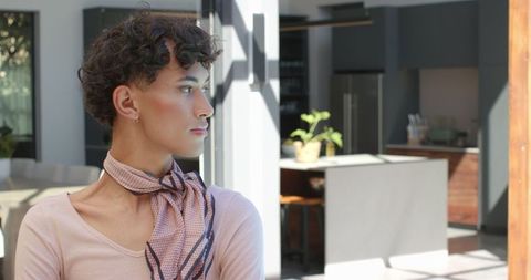 Elegantly Dressed Man in Modern Kitchen Interior