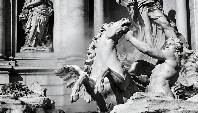 Rearing pegasus and muscular figure conveying motion in neoclassical marble fountain sculpture