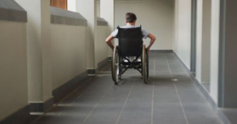 Wheelchair User Navigating School Hallway with Confidence - Download Free Stock Images Pikwizard.com