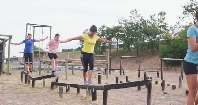 Women Balancing on Obstacle Course During Outdoor Fitness Training - Download Free Stock Images Pikwizard.com