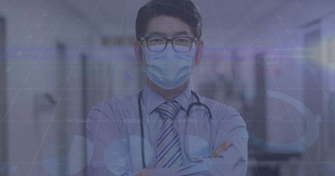 Asian Doctor with Mask Analyzing Medical Data During Pandemic