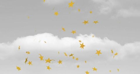 Golden stars suspended in cloudy celestial sky