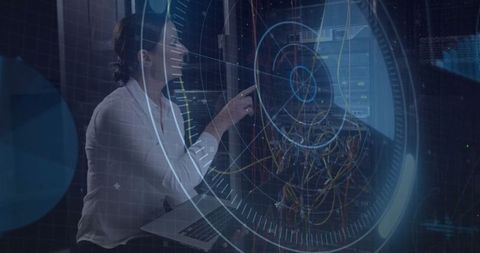 Technician Monitors Server System with Futuristic Holographic Interface