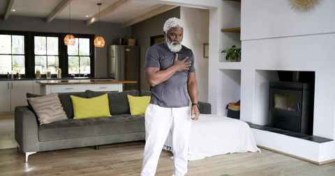 Senior African American Man Enjoying Relaxation Exercise at Home