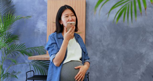 Pregnant Woman Talking on Smartphone in Home Office Environment - Download Free Stock Images Pikwizard.com