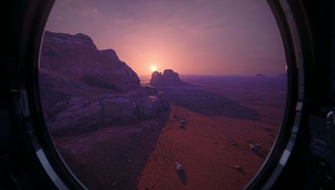 Sunset view through spacecraft porthole over red rocky desert and butte panorama at dusk