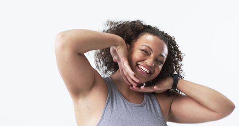 Confident Young Woman Positively Smiling with Curly Hair - Download Free Stock Images Pikwizard.com