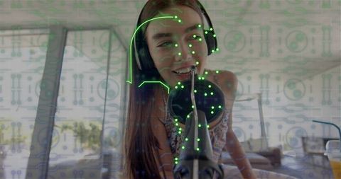 Young woman recording podcast at home with headset and microphone, digital face overlay