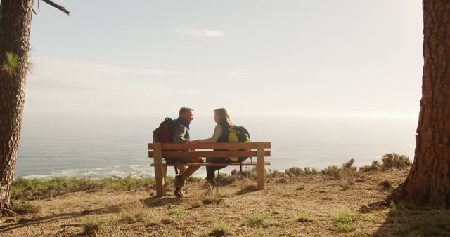 Couple Relaxing on a Bench Overlooking Ocean View - Download Free Stock Images Pikwizard.com