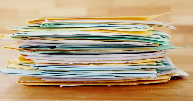 Stack of Colorful Documents on Wooden Desk - Download Free Stock Images Pikwizard.com