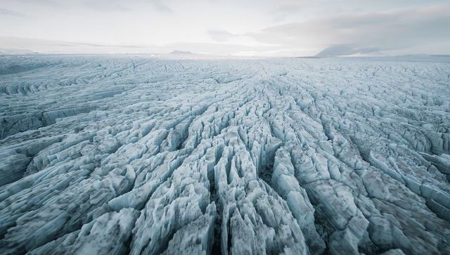 Frozen labyrinth of crevasses: aerial arctic glacier with ice ridges and seracs