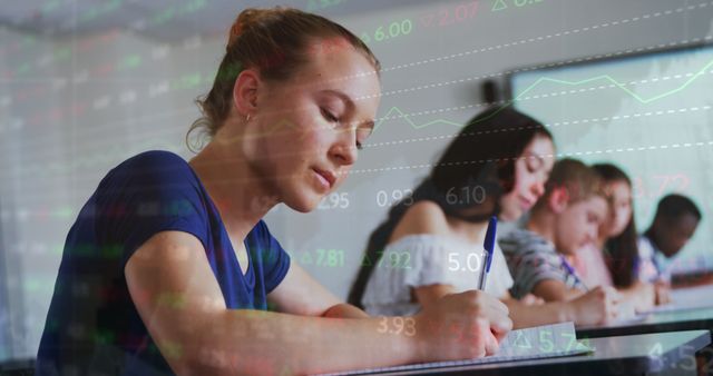 Diverse Students Writing in Class with Stock Market Data Overlay - Download Free Stock Images Pikwizard.com