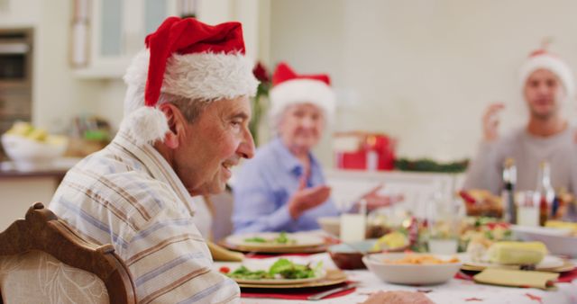 Senior Family Members Celebrating Christmas Together Around Dinner Table - Download Free Stock Images Pikwizard.com