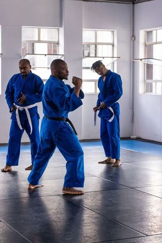 Dedicated Martial Artists Practicing in Dojo