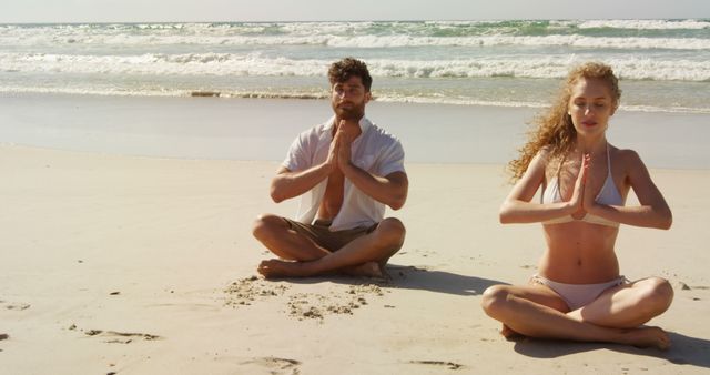 Couple Performing Yoga Meditation on Tranquil Beach - Download Free Stock Images Pikwizard.com