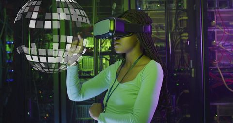 African American Woman Engaging with VR in Server Room