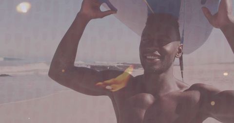 Shirtless surfer joyfully holding surfboard at sunny beach