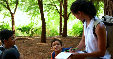 Teacher Engaging with Students in Nature - Download Free Stock Images Pikwizard.com