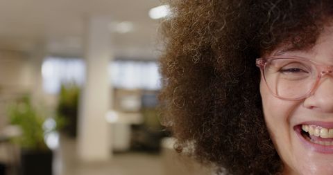 Joyful Businesswoman Smiling in Modern Office