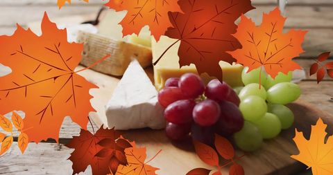 Autumn Leaves Overlay on Gourmet Cheese Board with Grapes