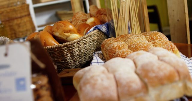 Freshly Baked Assorted Bread Loaves and Rolls on Display Table - Download Free Stock Images Pikwizard.com