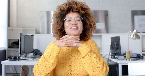 Confident Businesswoman Engaging in Video Call at Office Desk