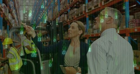 Businesswoman Utilizing Technology in Warehouse