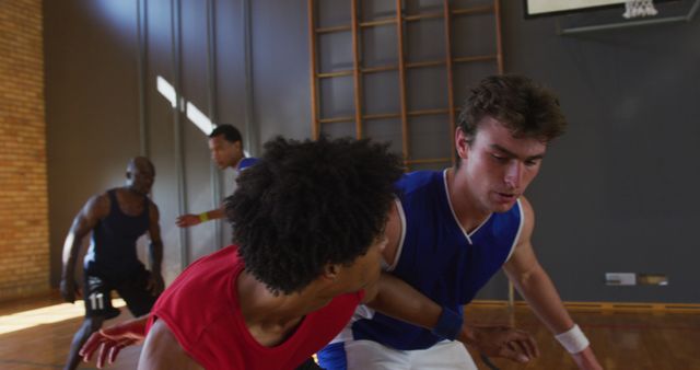 Intense Basketball Game in Indoor Court with Young Athletes - Download Free Stock Images Pikwizard.com