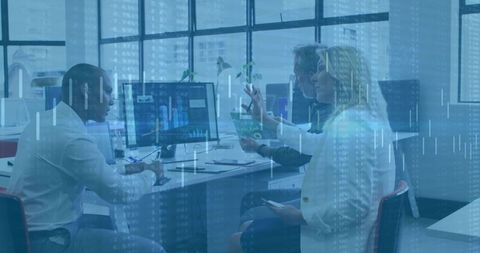 Professionals Collaborating with Financial Charts and Technology