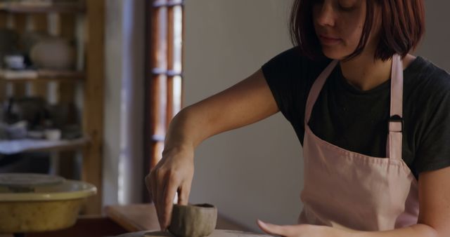 Female Artisan Sculpting Clay in Pottery Studio - Download Free Stock Images Pikwizard.com