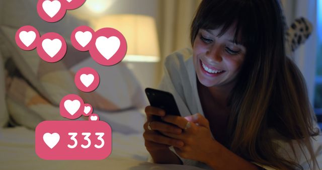 Image of digital interface with social media love heart icons over woman using smartphone lying on bed. Global digital social media network digitally generated image.