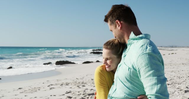 Couple Embracing on Tranquil Beach during Sunny Day - Download Free Stock Images Pikwizard.com