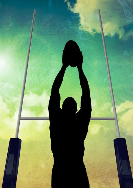 Silhouette of rugby player catching ball with goalposts in background and sky filled with clouds. Ideal for use in sports promotions, athletic event advertisements, motivational posters, and articles about rugby or teamwork.