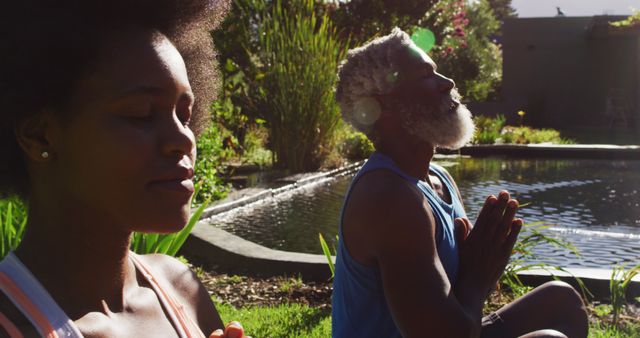 Senior Couple Meditating in Peaceful Garden by Pond - Download Free Stock Images Pikwizard.com