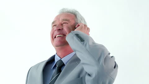 Smiling Senior Manager Engaged in Phone Conversation