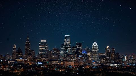 Starry night over illuminated charlotte urban skyline
