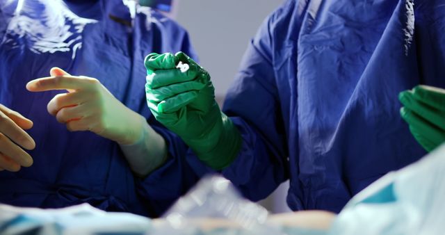 Doctors Wearing Surgical Gowns and Gloves Performing Operation - Download Free Stock Images Pikwizard.com