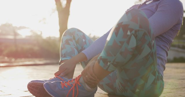 Woman Lacing Up Running Shoes at Sunrise in Park - Download Free Stock Images Pikwizard.com