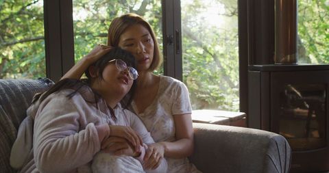 Comforting Embrace Between Asian Mother and Daughter