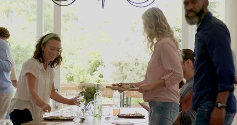 Family Setting Table for Festive Meal Celebration
